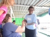 Joanna greets a village friend heading out the ship as well